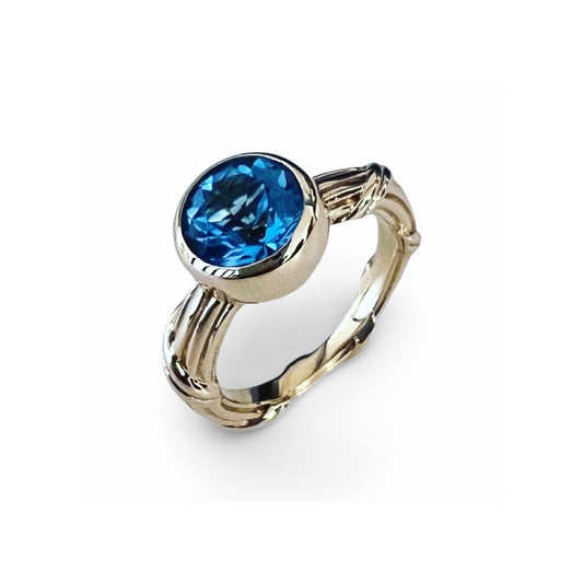 Fantasies Blue Topaz Bezel Set Solitaire Ring in 18k yellow gold